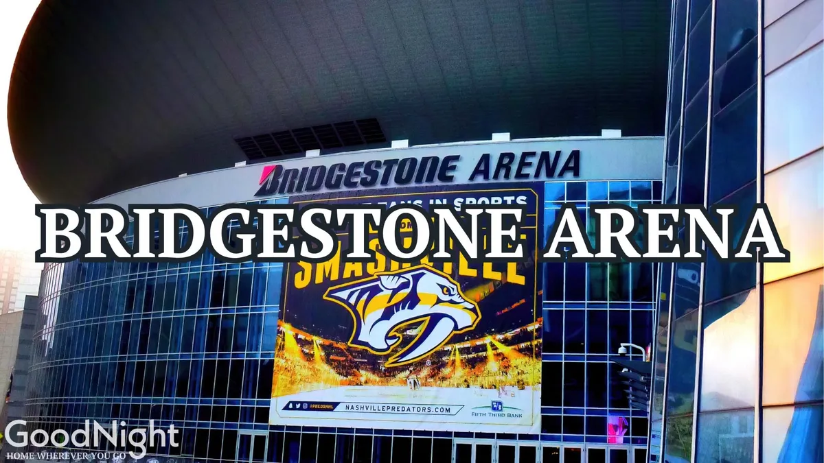 A striking exterior shot of Bridgestone Arena with clear signage and lively banners, reflecting the buzz of concerts and events that define the area’s nightlife.