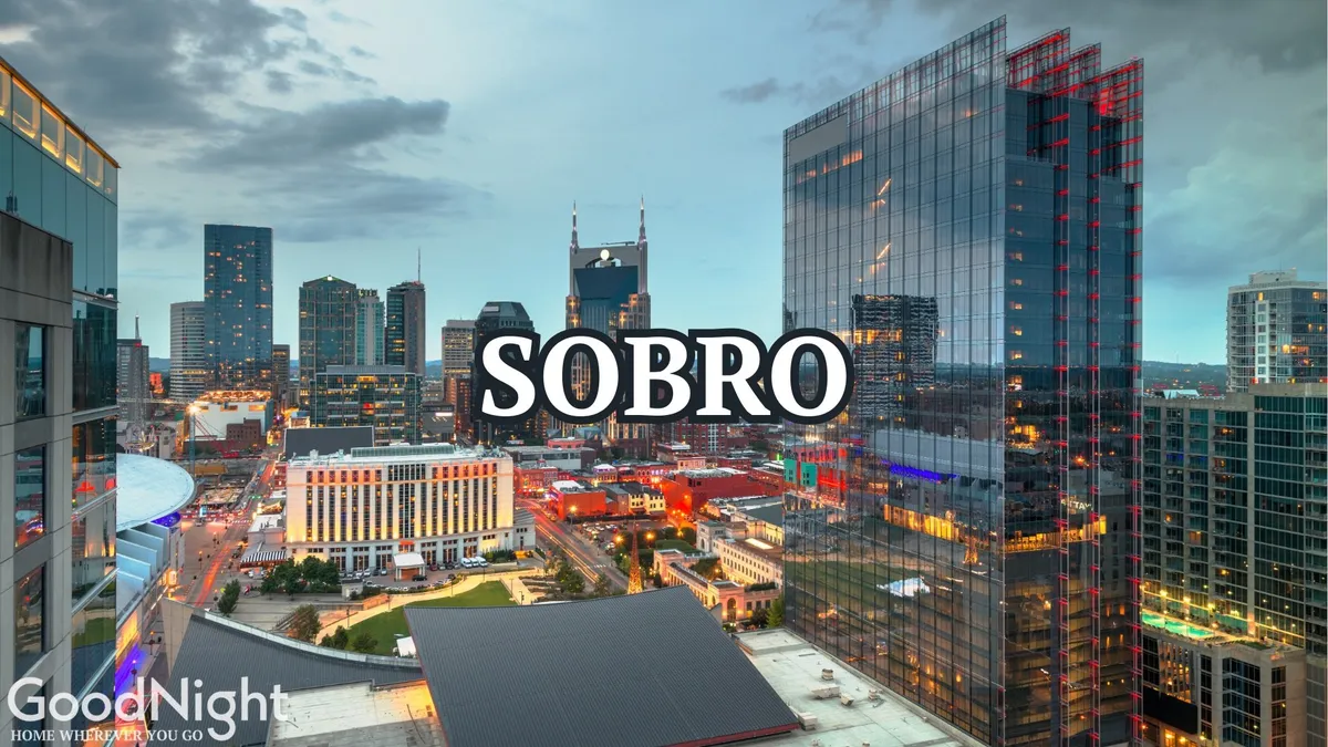 A dynamic cityscape at dusk with the glowing skyline, bustling buildings, and the text 'SOBRO,' evoking the energy and excitement of downtown Nashville's nightlife and attractions.