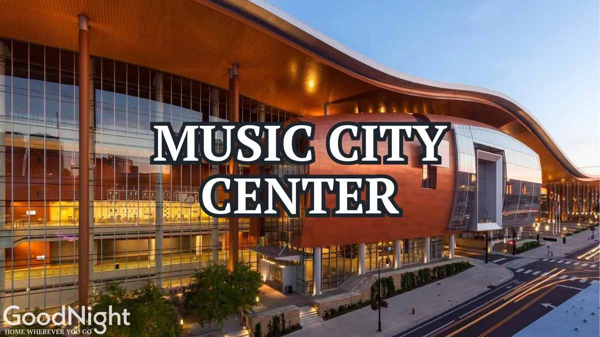 The impressive exterior of a major Nashville music venue, with its iconic curved roof and vast entrance area. The building’s contemporary design and welcoming facade hint at the city’s rich musical heritage and ongoing cultural events.