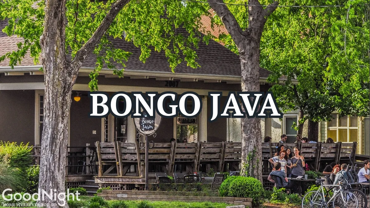 An exterior view of the Bongo Java café, featuring its welcoming sign, lively outdoor seating area, and groups of people enjoying coffee and conversation. The scene captures the vibrant street life and communal atmosphere characteristic of Nashville's thriving neighborhoods.
